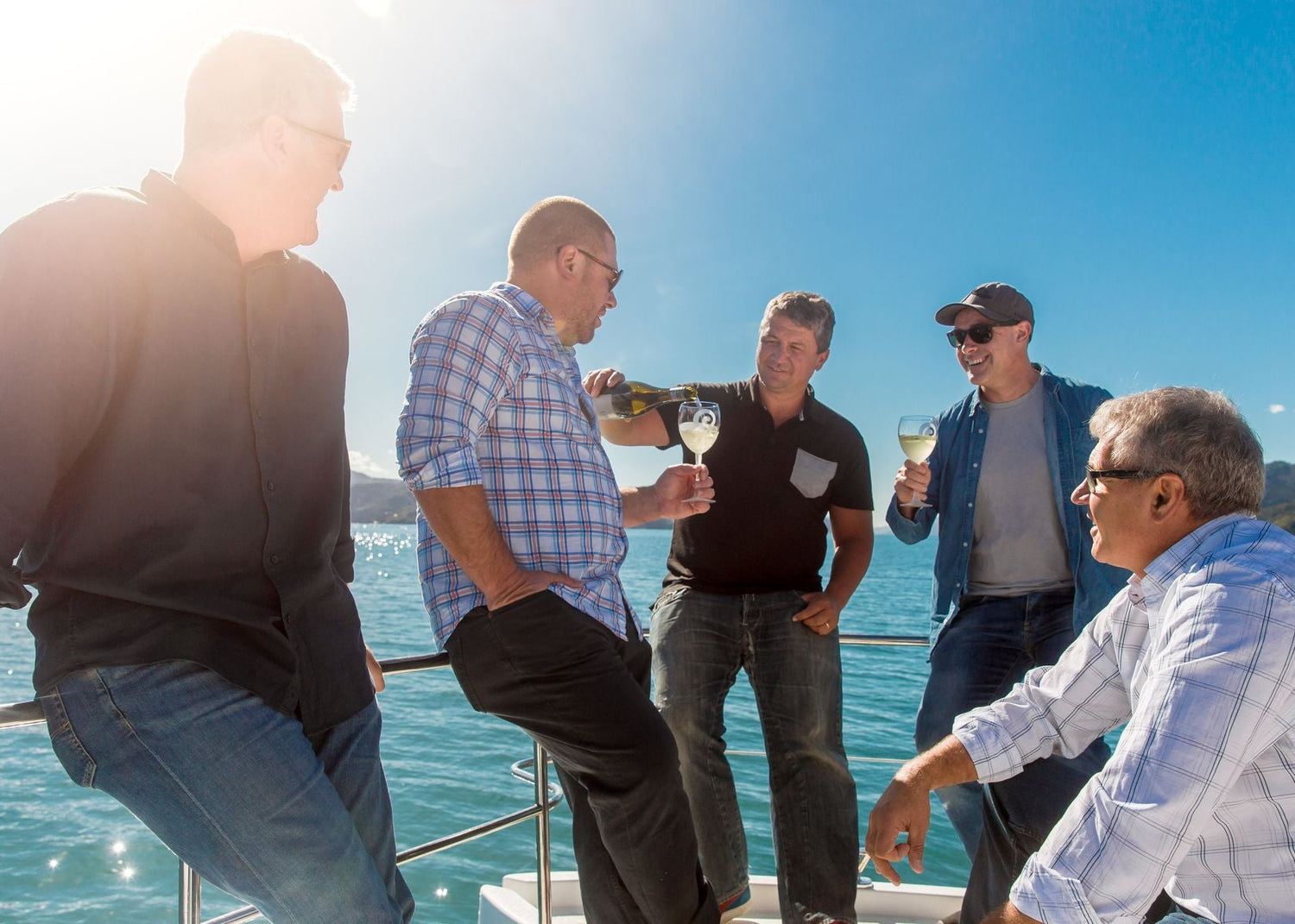 Indigenous winemakers of New Zealand enjoying an opportunity to share wines and knowledge in beautiful New Zealand waters